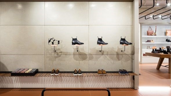 A shoe store with a lot of shoes on display