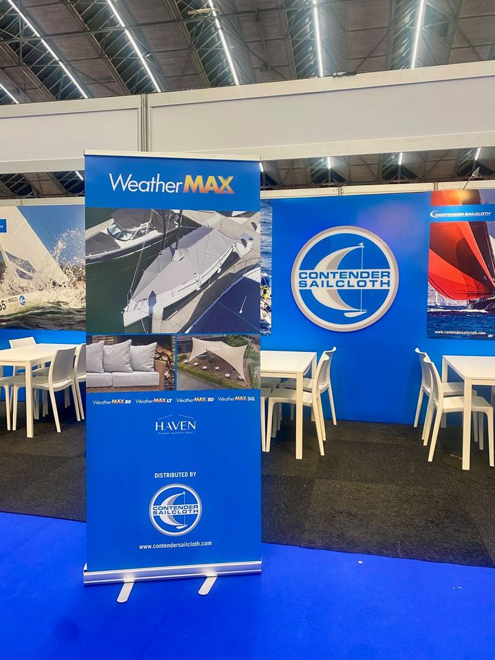 Contender banner at the METS expo showing drone photo of boat cover 