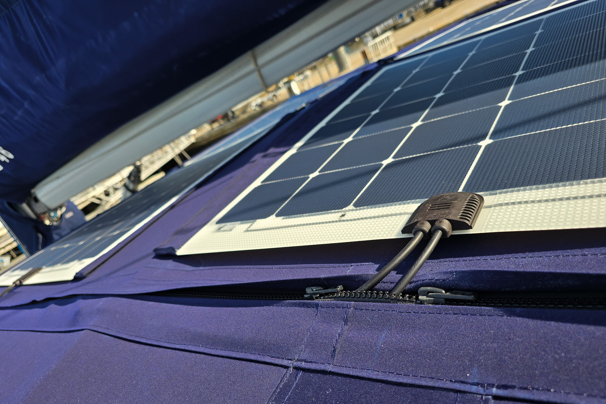 Details of solar panels cabling inserted into canvas pocket