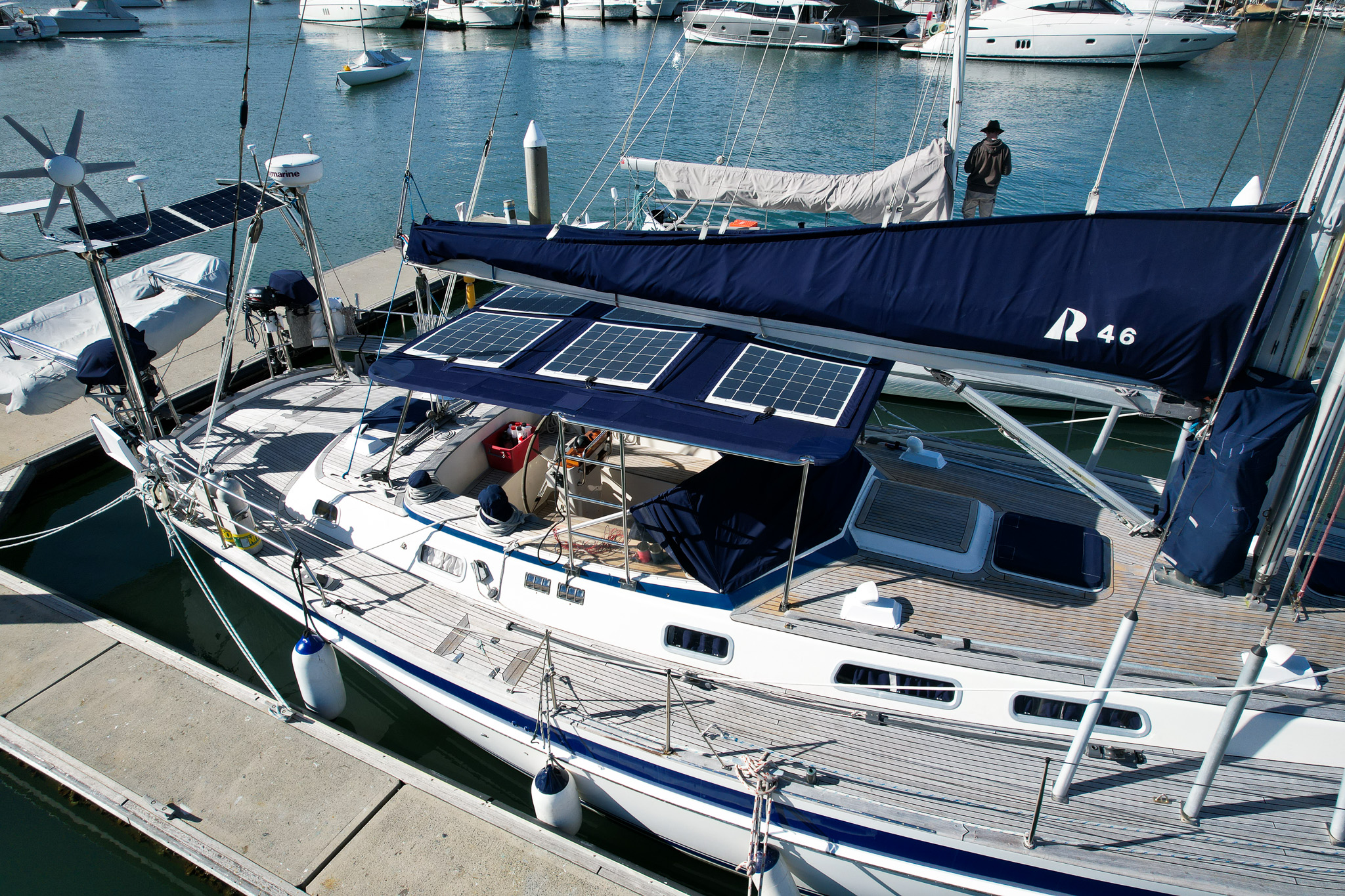 Solar panels attached to bimini navy blue on sailing yacht