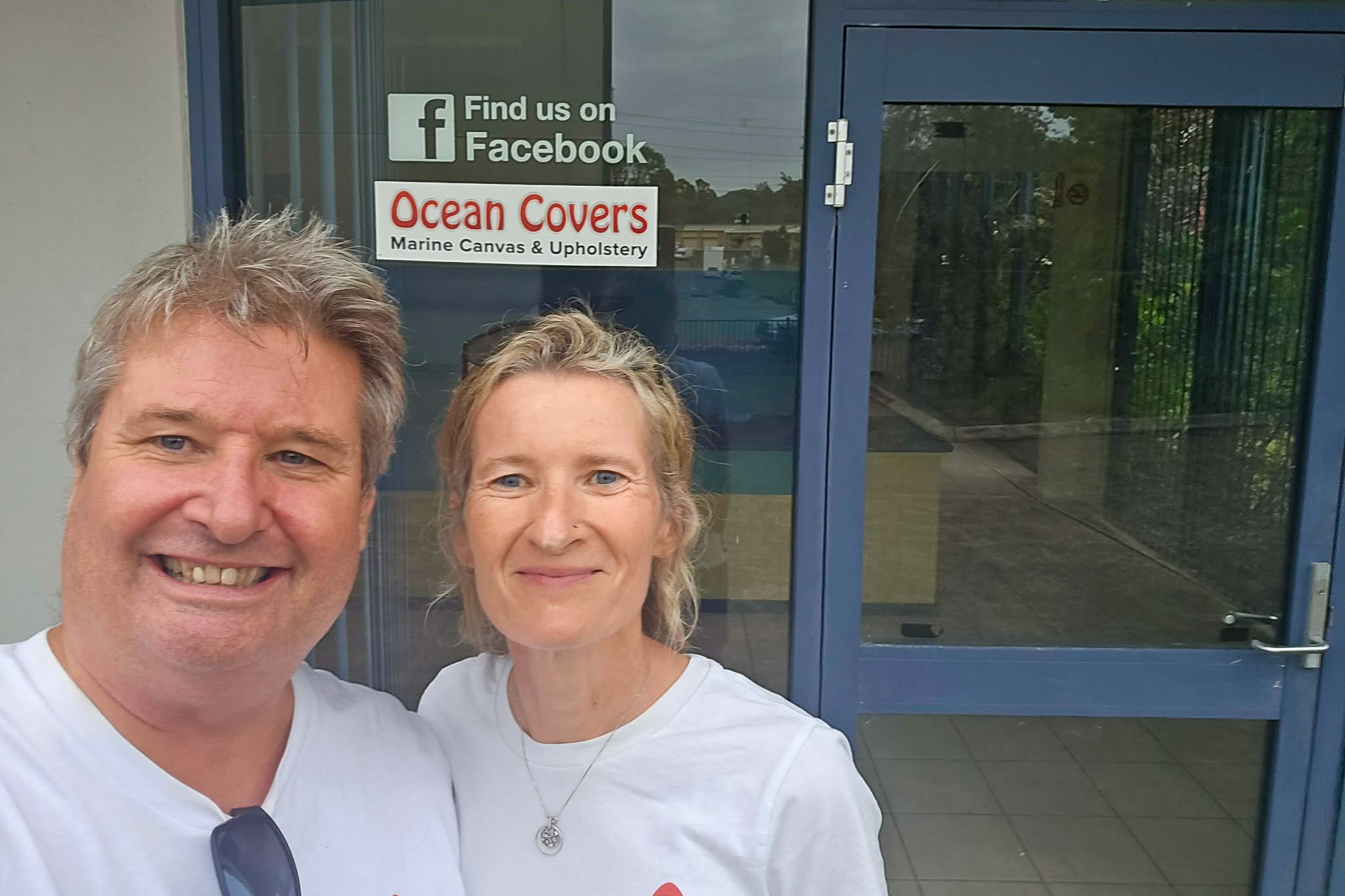 Ocean Covers founders Beryn and Gabrielle standing in front of their new Central Coast workshop entrance