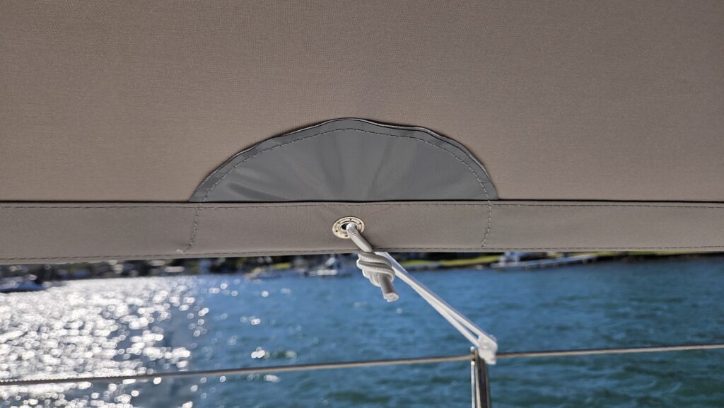WeatherMax overall cover detail Close-up of marine-grade PVC-reinforced eyelet on a custom WeatherMax overall cover for an Italia Yachts 9.98, Lake Macquarie