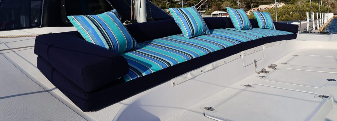 Seawind 1160 sun lounge upholstered in Sunbrella Dolce Oasis and Navy