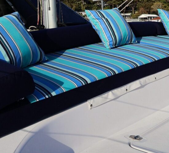 Seawind 1160 sun lounge upholstered in Sunbrella Dolce Oasis and Navy